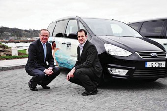 Eddie Murphy, managing director of Ford Ireland, with Mark Anderson, director of Titanic 100 Cobh project, at the handover of two specially liveried Ford Galaxy MPV models as part of Ford’s partnership with the Titanic 100 Cobh 2012 centenary project.