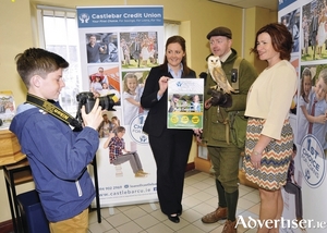 PHOTO COMPETITION: Pictured in Castlebar Credit Union at the launch of the Youth Nature Photo Competition in association with Bird Watch Youth was Jeremy Bolger, who is hoping to take a winning photo of Oisin the owl. Also in the picture are Majella Mulchrone, Castlebar Credit Union, Jason Deasy, falconer at Mount Falcon, and Eileen Bolger, Bird Watch Youth. For more information you can visit www.birdwatchyouth.com. Photo: Ken Wright.