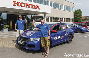 Pictured (L to R) with the record breaking Honda Civic Tourer 1.6 i-DTEC are Fergal McGrath and Julian Warren.