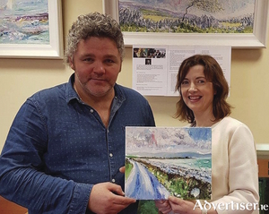 Artist Jim McKee with Siobhan Arkins of Ballybane Library.