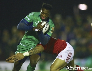 Niyi Adeolokun is tackled by Munster&#039;s Francis Saili in action from the Guinness Pro12 game at the Sportsground on Saturday. Photo: Mike Shaughnessy