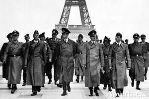 Hitler arrives in Paris in 1940.