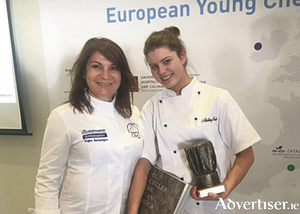 Aisling Rock is presented with her award by Greek celebrity chef Argiro Barbarigou from the famed Papadakis restaurant in Athens.
