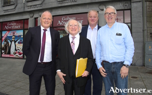 Uachtar&aacute;n na h&Eacute;ireann Michael D Higgins pictured with Galway Advertiser editor Declan Varley (left), managing director Peter Timmins (centre), and company chair Ronnie O&#039;Gorman (right). Photo:- Mike Shaughnessy