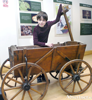 A relic of famine times - young Lochlainn Sweeney proudly displays a Goat Cart synonymous with famine times at the opening of the Ballina Lions Famine Exhibition. The antique goat cart was a gift to his grandparents Ruth and Adrian Bourke from their beloved local antique dealer Billy Sommerville in the hope it&#039;s historical heritage would be preserved and is now just one of the outstanding exhibits in the Ballina Lions Club Famine Exhibition. Photo: Henry Wills 