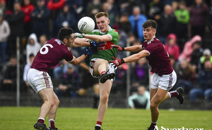 No way through: John Gallagher tries to get a pass away under pressure. Photo: Sportsfile 