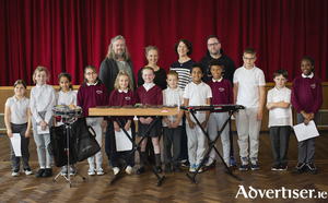 Hugh Kelly, director of Maoin Ceoil na Gaillimhe; Anna Lardi-Fogarty from Music for Galway; Aislinn &Oacute; hEocha, director of Bab&oacute;ro; and Terry Cooke, percussionist,  with pupils from Scoil Chro&iacute; &Iacute;osa, Newcastle, who are taking part in the &#039;Carnival of the Animals&#039; education outreach programme developed by Hugh Kelly of Adventures in Music and Maoin Ceoil na Gaillimhe in association with Babor&oacute; and Music for Galway. Photo:- Anita Murphy