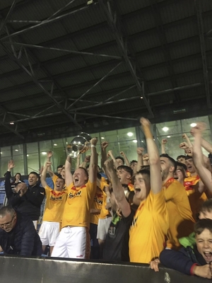 Cup of Joy: Castlebar Mitchels captain Eamon Tiernan lifts the cup after his sides four point win over Kilmaine. Photo: MayoGAA 
