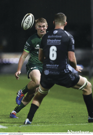 Connacht&#039;s Conor Fitzgerald produces a clever chip past Huw Taylor of Dragons during the Guinness PRO14 match at Rodney Parade in Newport, Wales. Photo by Gareth Everett/Sportsfile