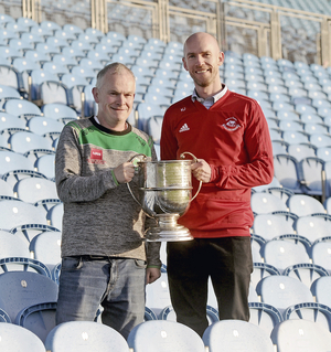 One hand on the title: Ballaghaderreen manager Paul McHugh and Ballintubber boss Kevin Johnson with the Moclair Cup ahead of the Connacht Gold Mayo GAA Senior Football Final. Photo: Conor McKeown. 