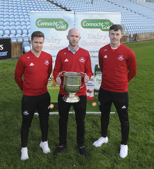 The boys from the &#039;Tubber: Ballintubber&#039;s Damien Coleman, Kevin Johnson and Diarmuid O&#039;Connor with the Moclair Cup ahead of the Connacht Gold Mayo GAA Senior Football Final. Photo: Conor McKeown. 