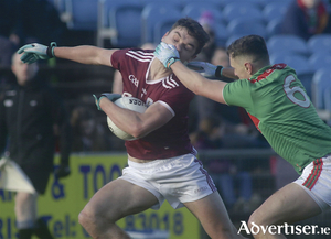 Galway&#039;s Michael Daly and Mayo&#039;s Michael Plunkett in action from the FBD Connacht Senior Football Championship semi-final at McHale Park on Sunday. Photo:-Mike Shaughnessy