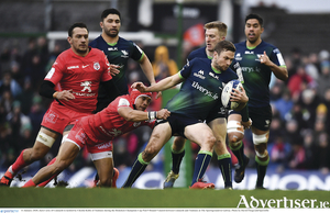 Jack Carty of Connacht is tackled by World Cup winner Cheslin Kolbe of Toulouse during the Heineken Champions Cup  match at The Sportsground in Galway. 