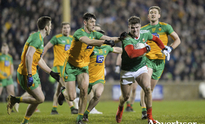 On the run: Jordan Flynn looks to break away from the Donegal defence on Saturday night. Photo: Sportsfile 