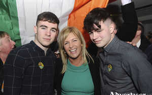 Rose blooms: Rose Conway Walsh Sinn F&eacute;in celebrates with her sons Peter and Anthony at the Mayo count at the TF Royal Theatre Castlebar. Photo: Conor McKeown