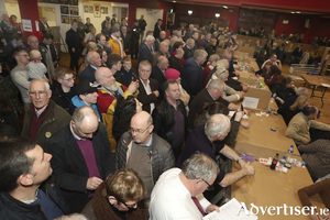 The waiting game: Supporters of the the candidates await the results of a count from Returning Officer Fintan Murphy. Photo: Michael Donnelly 