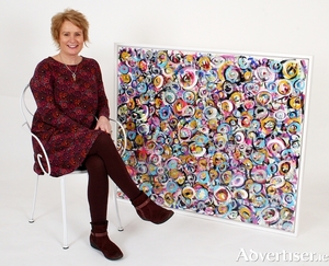 The artist Adrienne M Finnerty with her work Joy Abundance.