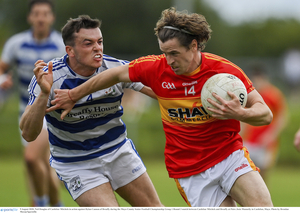 You won&#039;t pass: Breaffy&#039;s Dylan Cannon tries to stop the progress of Neil Douglas from Castlebar Mitchels. Photo: Sportsfile 