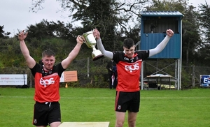 Back in their arms: Ballyhaunis joint captains Adrian Brennan and Kieran Kiely lift the Tyrell Cup. Photo: Ciara Buckley 
