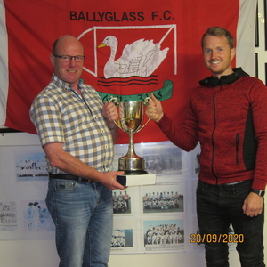Charlie O&#039;Malley, Clubperson of the Year, Ballyglass FC, receives the Martin Moran Memorial Cup from Club Chairman, Darren Reilly, 