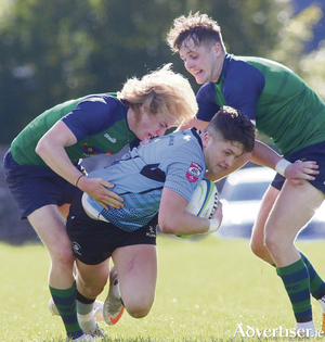 Galwegians&#039; Darragh Kennedy is tackled by Ballina&#039;s Cian Quinn and Ian West in the opening game of the new Energia All Ireland League division 2B season at Crowley Park, Glenina on Saturday. Photo: Mike Shaughnessy