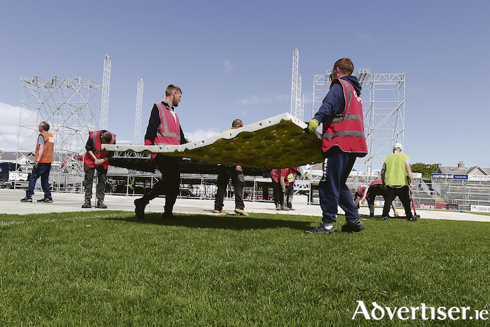 First the Rossies and now the Black Eyed Peas — A protective covering is laid on the pitch at Pearse Stadium ahead of Saturday’s concert. Photo:- Mike Shaughnessy