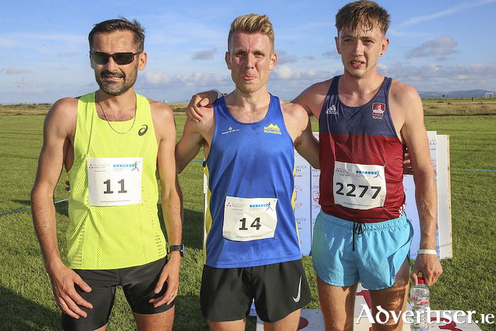 Streets of Galway men's winner   Andrew Annett from Mourne Runners (centre) with second place Sergiu Ciobanu from Cloniffe (left) and Donal Devane Ennis Track 24 (right), third. 