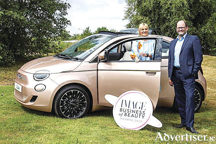 Melanie Morris, Image contributing editor and John Saunders, managing director at Fiat Ireland, with the Fiat 500 Electric.