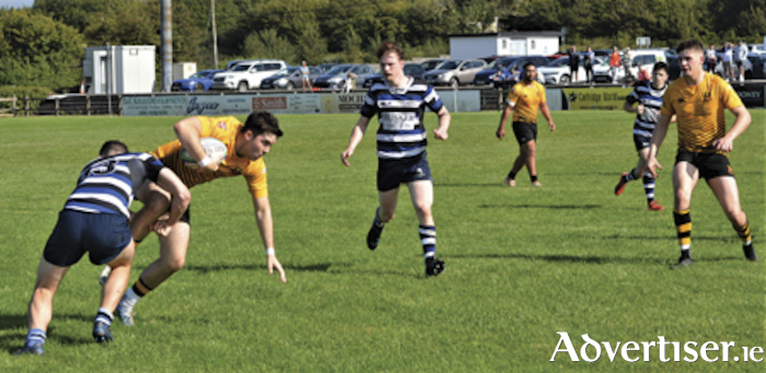 BUccaneers full back Ruaidhri Fallon is tackled by Tomas Forde of Corinthians during the Dubarry Park team’s Connacht Senior League victory on Saturday