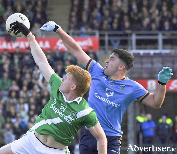 Moycullen's Peadar Ó Cuaig for the winners, and Salthill Knocknacarra's Tomo Culhane in action from the Bons Secours Galway County Football final at Pearse Stadium on Sunday. 