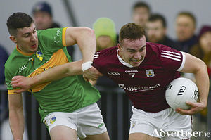 Galway&#039;s Daniel Flaherty escape the clutches of Leitrim&#039;s Jack Heskin in the Connacht FBD League game in the University of Galway Connacht GAA Air Dome on Friday night. Photo:- Mike Shaughnessy 