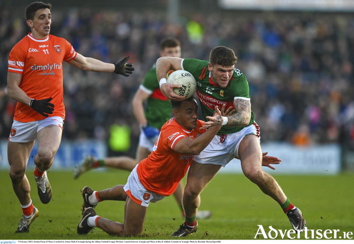Front foot Flynn: Jordan Flynn of Mayo is tackled by Jemar Hall of Armagh during Mayo's draw with Armagh. Photo: Sportsfile. 