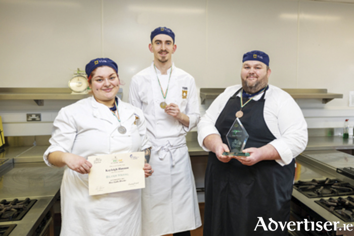 Student chefs Kayleigh Hannon (silver medal, Risotto competition), Liam Martin (silver medal, Fish competition) and Martin Duffy (class winner, Chocolate Sculpture competition) celebrate their success at the Chef of Ireland competition at CATEX. Photo: Nathan Cafolla.
