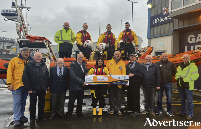 Representatives from the City of Galway Shipping company visited Galway RNLI to present the charity with a donation of €5,000. In the boat, from left: Galway RNLI volunteer crew Frankie Leonard, David McGrath, James Corballis and James Rattigan. Standing, from left: Paul Carey, Galway RNLI; Tom McElwain, City of Galway Shipping; Pat Lavelle, Galway RNLI Fundraising; John Coyle, City of Galway Shipping company board member and RNLI Vice-President; Stefanie Carr, Galway RNLI; Dr John Killeen, City of Galway Shipping company board member and RNLI Trustee; Pierce Purcell, Galway Maritime; Mike Cummins, Galway RNLI and Seán Óg Leydon, Galway RNLI.