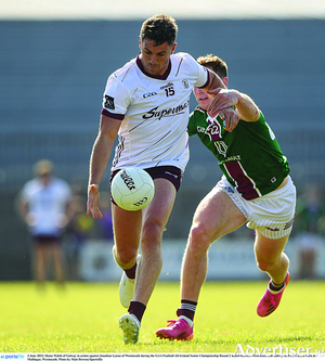 Shane Walsh of winners Galway, who limped off the field,  in action against Jonathan Lynan of Westmeath during the GAA Football All-Ireland Senior Championship round two match at TEG Cusack Park in Mullingar, Westmeath. 
Photo by Matt Browne/Sportsfile