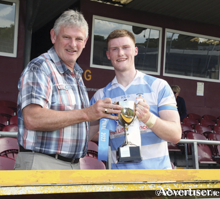 Athlone captain, Shane Allen, receives the ACFL Division 2 cup from Westmeath GAA chairperson Frank Mescall in TEG Cusack Park on Sunday evening
