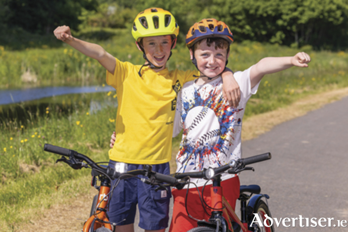 JJ Doyle (10) and Christian Doyle (8)  are pictured on the Old Rail Trail linked to the Royal Canal Greenway in County Westmeath gearing up for ‘Great Outdoors Month’.  The Royal Canal Greenway and Old Rail Trail in County Westmeath offer breathtakingly scenic cycle routes that run alongside the Royal Canal and an old railway line through the Hidden Heartlands. Photo by: Paul Moore Photography.
