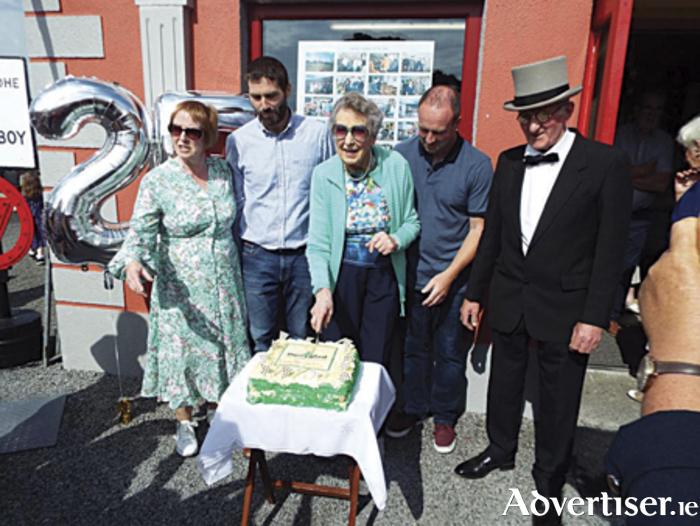 Helen O'Brien, guest of honour, cuts the cake to mark the 25th anniversary of Derryglad Folk and Heritage Museum.  Also pictured are Thomas, Bridie, Charlie and Jonathan Finneran