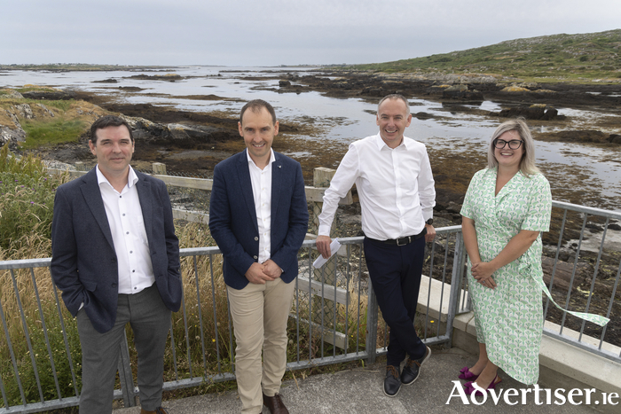 Representatives of Sceirde Rocks Windfarm after they had announced a community benefit fund at the Emigrant Centre, Carna.  From left: Kieran O’Malley, Sceirde Rocks Windfarm (SRW) Project Manager; Tim Coffey, Project Director and Michael Cloherty, SRW Consent and Stakeholder Lead. On right is Máire Éinniú, Development Executive, Údarás na Gaeltachta. 