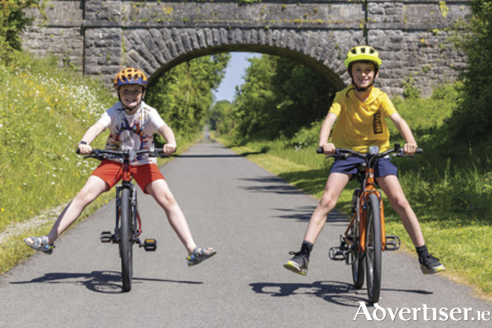 Christian Doyle and JJ Doyle are pictured on The Old Rail Trail linked to The Royal Canal Greenway in County Westmeath.  The Royal Canal Greenway and Old Rail Trail in County Westmeath offer breathtakingly scenic cycle routes that run alongside the Royal Canal and an old railway line through the Hidden Heartlands.  Visitors can now cycle from the heart of Athlone town with its award-winning restaurants and cultural attractions, to Mullingar and on to Maynooth or Longford, without ever leaving these safe, off-road scenic routes. Photo by: Paul Moore Photography