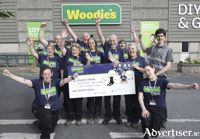 Staff of Woodie’s Headford Road, Galway with Dee and Joe Jordan of  Autism Assistance Dogs Ireland at the presentation of a cheque for €6520 raised during the ninth annual Woodie’s Heroes campaign.