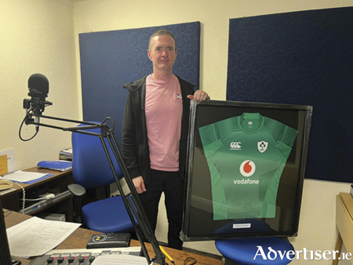 Athlone Community Radio presenter Dessie Parkes pictured with one of the two signed and framed Robbie Henshaw Ireland jerseys