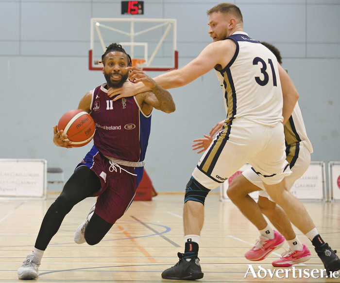 Ulster University's Ruaidhri Milligan attempts to stop Maree's KJ Bosley in action from the InsureMyVan.ie Mens Superleague game at Kingfisher Sports arena on Saturday night. Photo: Mike Shaughnessy