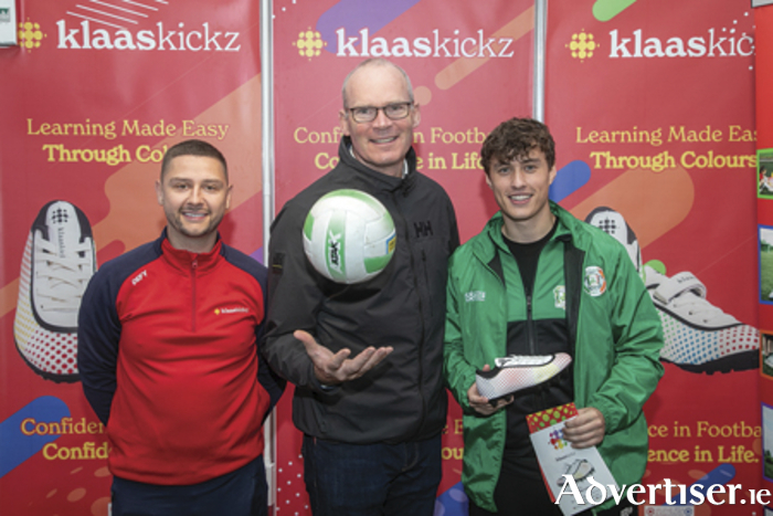Mark Connaughton owner Klaas Kickz, Simon Coveney, Minister for Enterprise, Trade and Employment and Sam Watkin who represented Ireland at six a side football during the year take time out for a photograph during the recent National Ploughing Championships