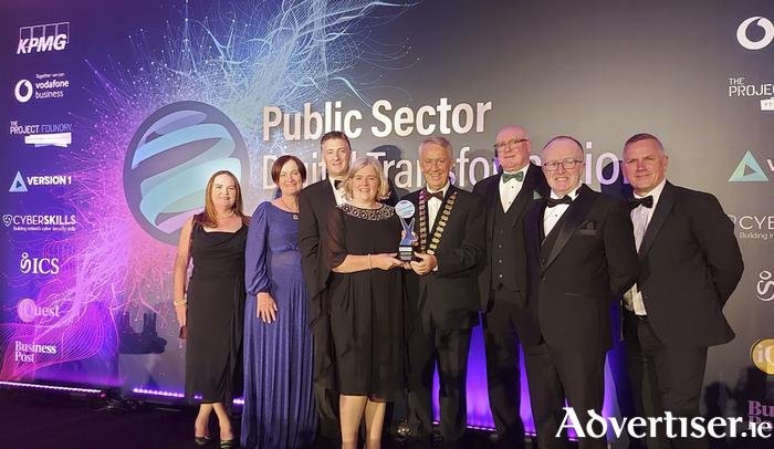 Pictured receiving The Best Community Engagement Award at the Public Sector Digital Transformation Awards 2023 from Left to right: Brídín Feeney, GIS Support, Galway County Council; Bernie Doherty, Galway Community Archaeologist; Liam Hanrahan, Director of Services, Economic Development and Planning, Galway County Council; Cllr Liam Carroll, Cathaoirleach of Galway County Council;Marie Mannion, Heritage Officer, Galway County Council; Liam Conneally, Chief Executive of Galway County Council; David Nolan, Digital Mapping Consultant; and Barry Doyle, GIS Project Leader, Galway County Council. 