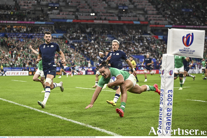 James Lowe of Ireland on his way to scoring Ireland's first try during the 2023 Rugby World Cup Pool B match. Photo by Harry Murphy/Sportsfile
