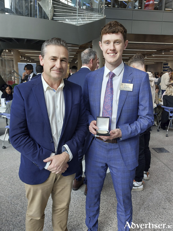 Congratulations to Evan Reilly of St Colman's College, Claremorris, who recently received the Naughton Scholarship in Trinity College, Dublin. Evan, who is studying biomedical science at University of Galway, is the second student in as many years from St Colman's College to win the prestigious award following the success of Mike Heaney last year. Mr Heaney is currently studying engineering at UCD. The Naughton Scholarship is awarded to students of exceptional ability who are continuing their studies in the science, technology, engineering or mathematics (STEM) fields. Former Taoiseach Enda Kenny was guest of honour at the ceremony and presented the awards. Evan is pictured with Roy Hession, Principal of St Colman's College at the awards ceremony in TCD on Saturday October 14.