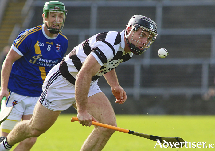 On the attack:Barry McDonagh of Turloughmore is chased by Loughrea's Ian Hanrahan in the Brooks Galway Hurling Senior Club Championships semi-final at Pearse Stadium on Sunday. Photo: Mike Shaughnessy