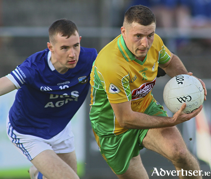 Corofin’s Dylan Wall is chased by Milltown’s Niall Costello in action from the Bons Secours Galway Senior Club Football Championship semi-final at Tuam Stadium on Sunday. Photo: Mike Shaughnessy