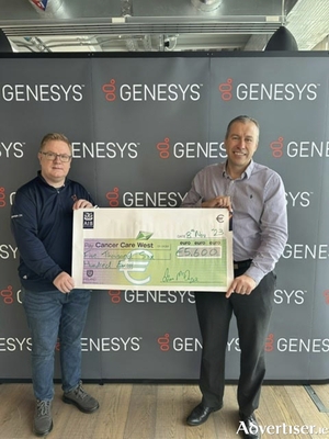 Liam McDwyer presenting cheque to Richard Flaherty, CEO, Cancer Care West. 